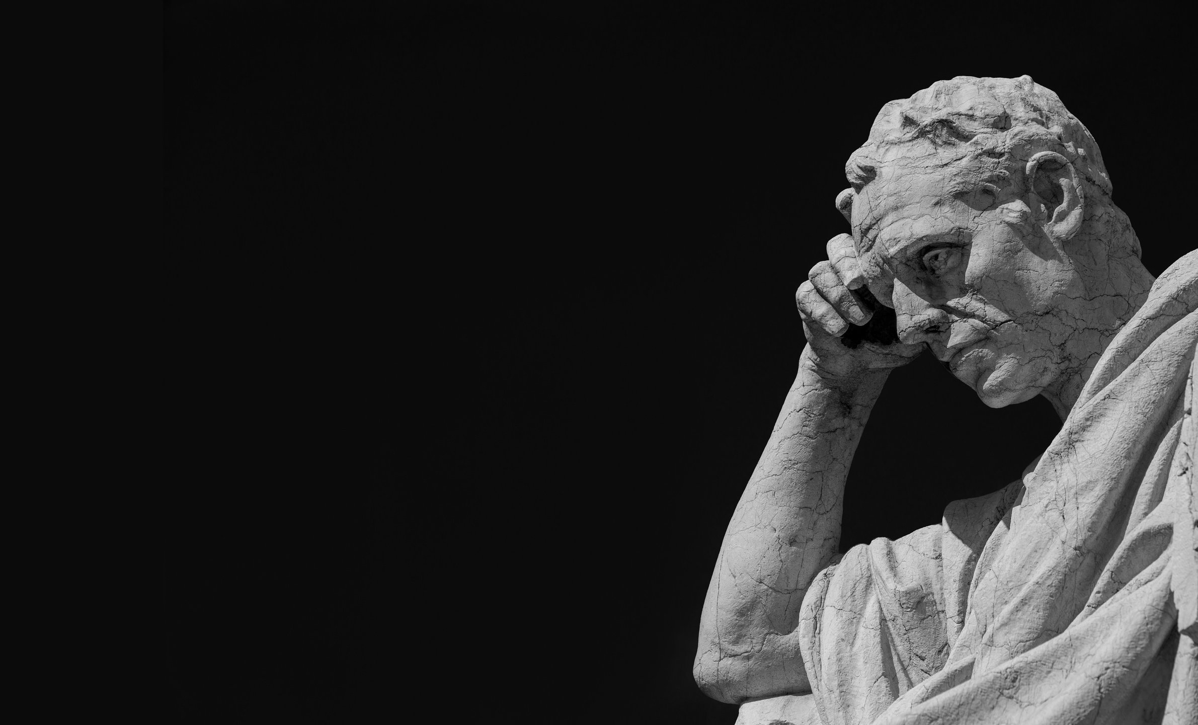 Thinking man statue (Black and White with copy space)